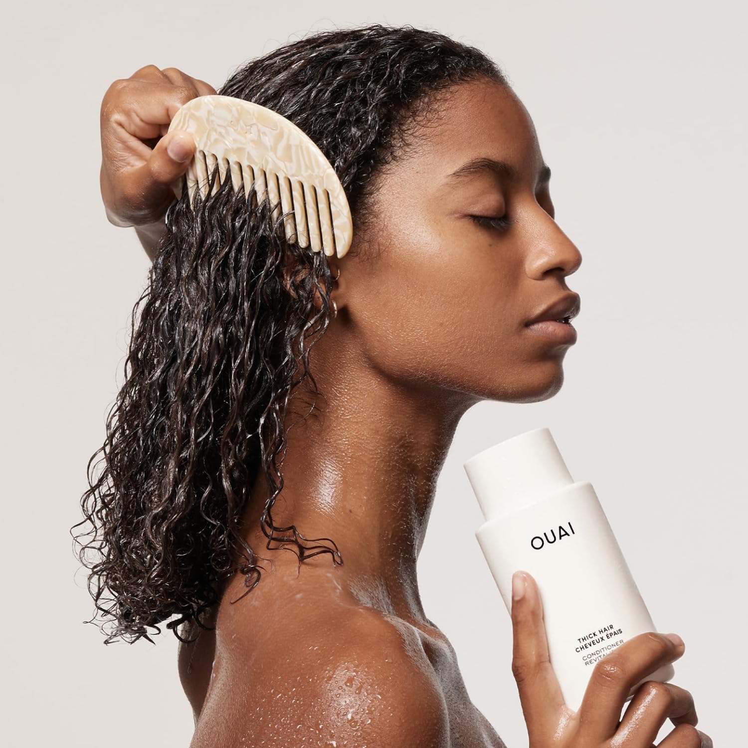 OUAI conditioner cream texture close-up showing rich formula for easier detangling
