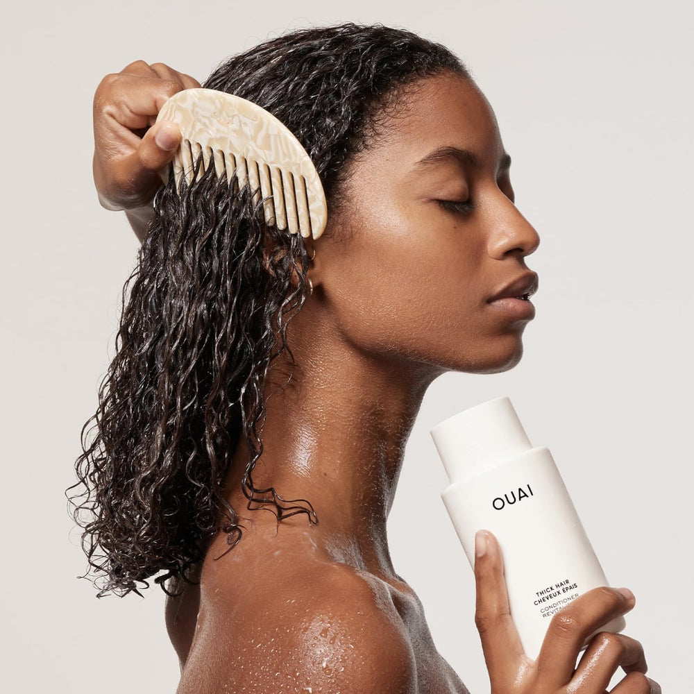 OUAI conditioner cream texture close-up showing rich formula for easier detangling