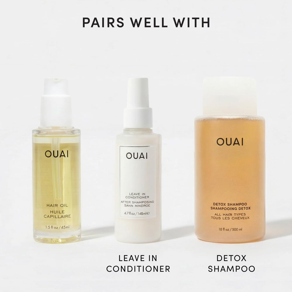OUAI travel bottle in purse lifestyle showing on-the-go touch-up convenience