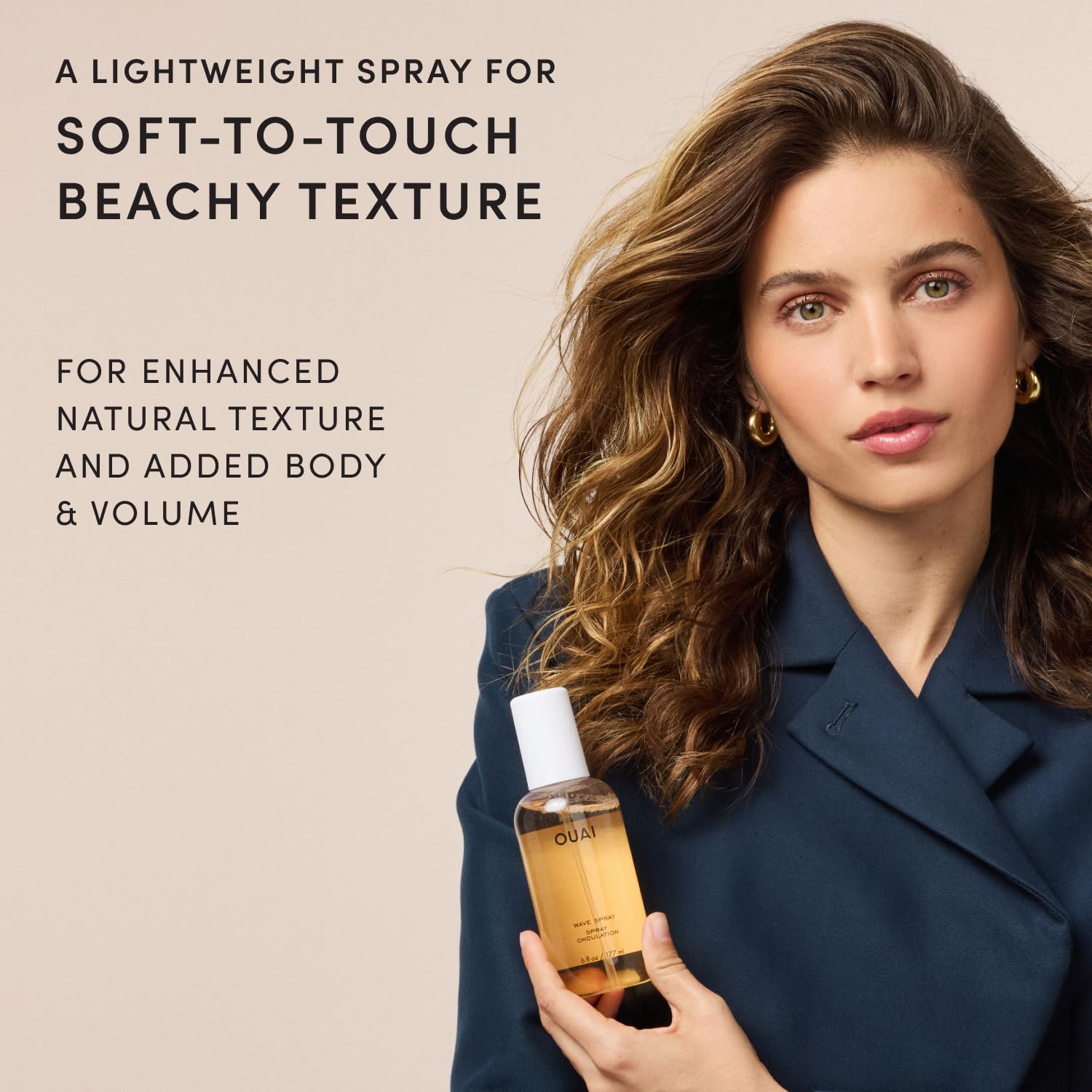 OUAI travel size bottle with cap highlighting portability and convenience
