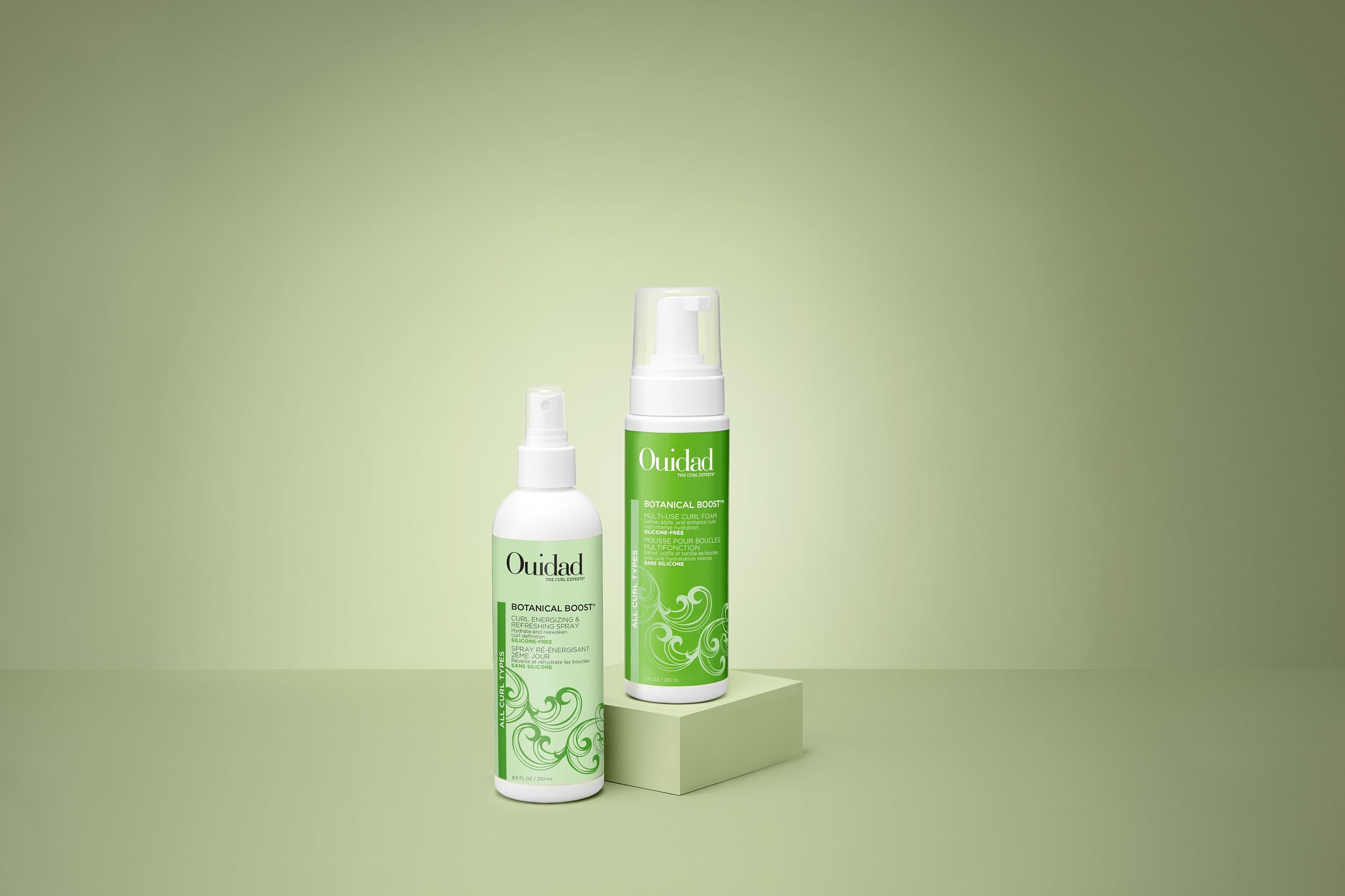 Ouidad mousse applied to damp curls demonstrating defined, frizz-reduced results