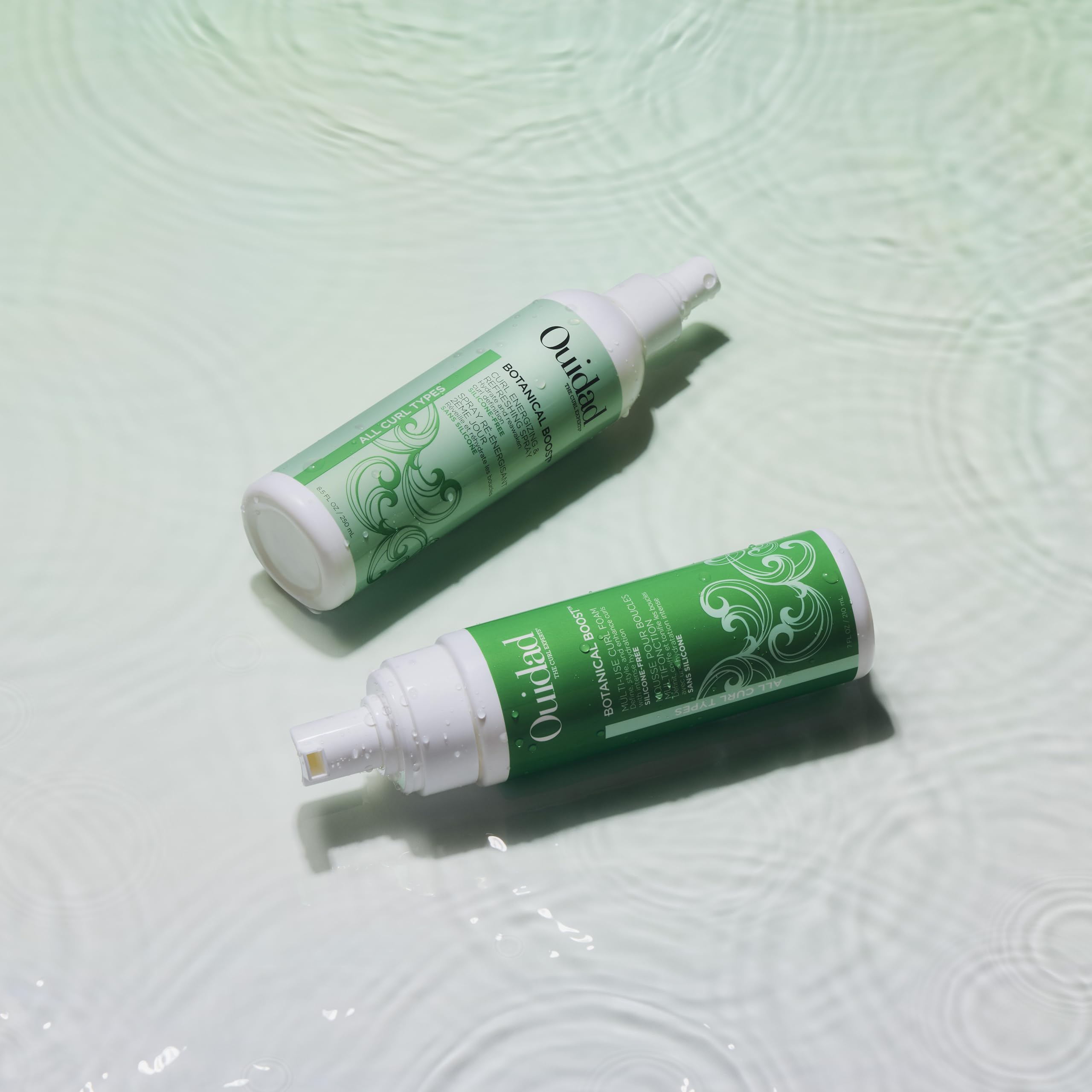 Ouidad ingredients display with rosehip and aloe highlighting natural hydration benefits