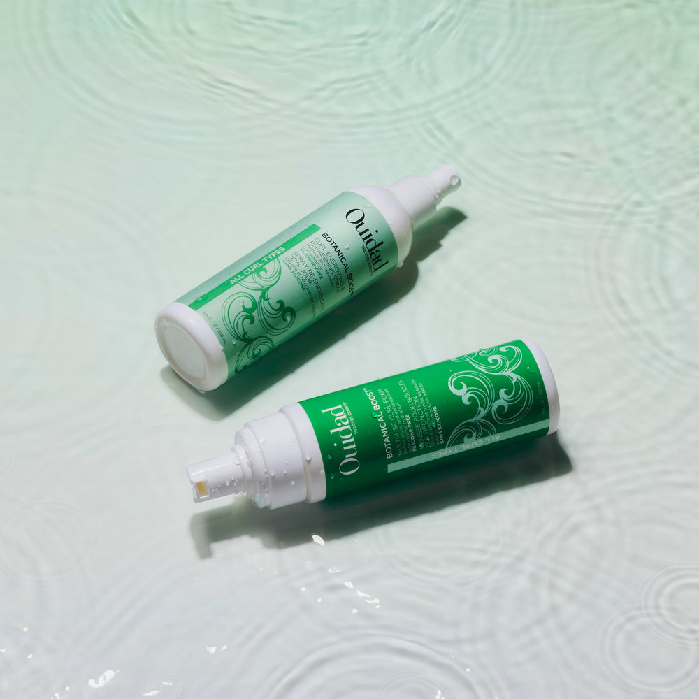 Ouidad ingredients display with rosehip and aloe highlighting natural hydration benefits