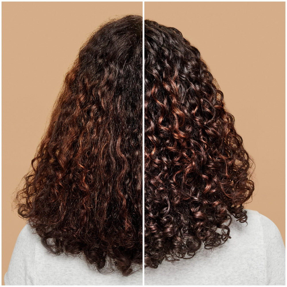 ouidad styling cream on hand applied to curly hair for soft definition