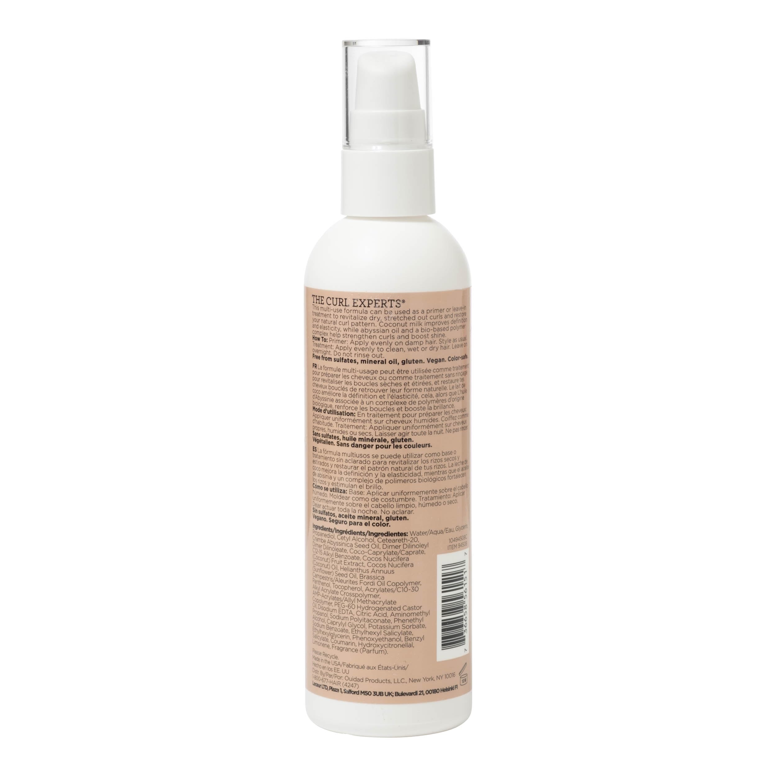 Person applying Ouidad Curl Shaper to damp curls for smoother styling
