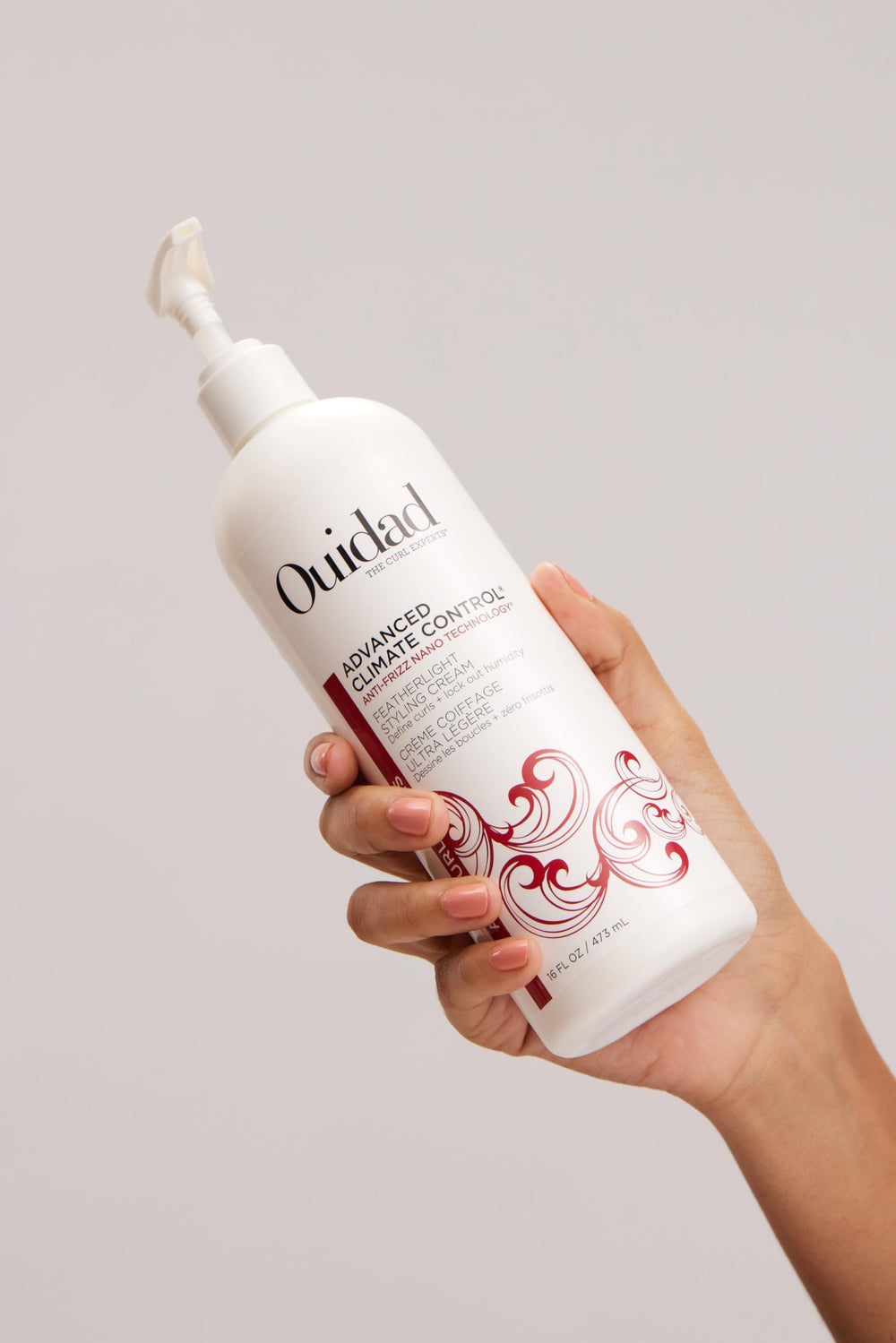 Ouidad being diffused for faster drying and lifted, touchable curls