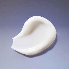 Ouidad conditioner in use detangling tight curls with a comb