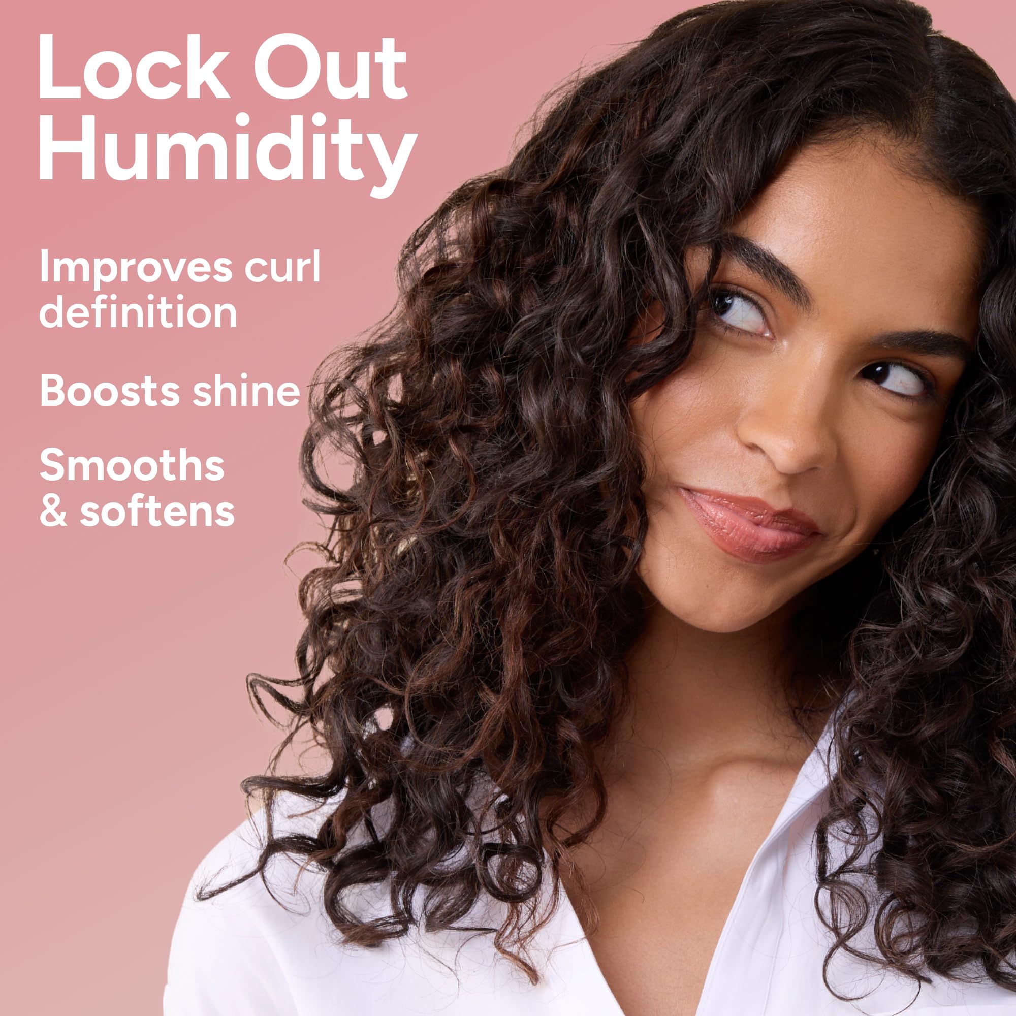 Lifestyle image of shiny, hydrated spiral curls styled with Ouidad