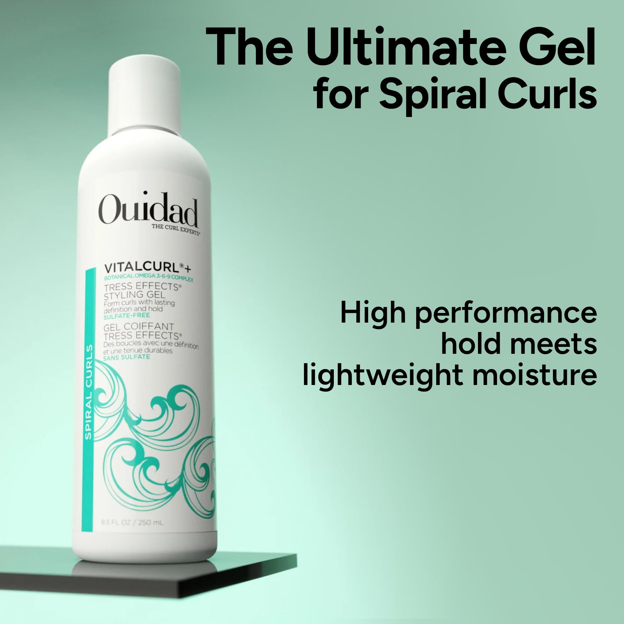OUIDAD bottle held in hand showing 8.5 fl oz scale and portability