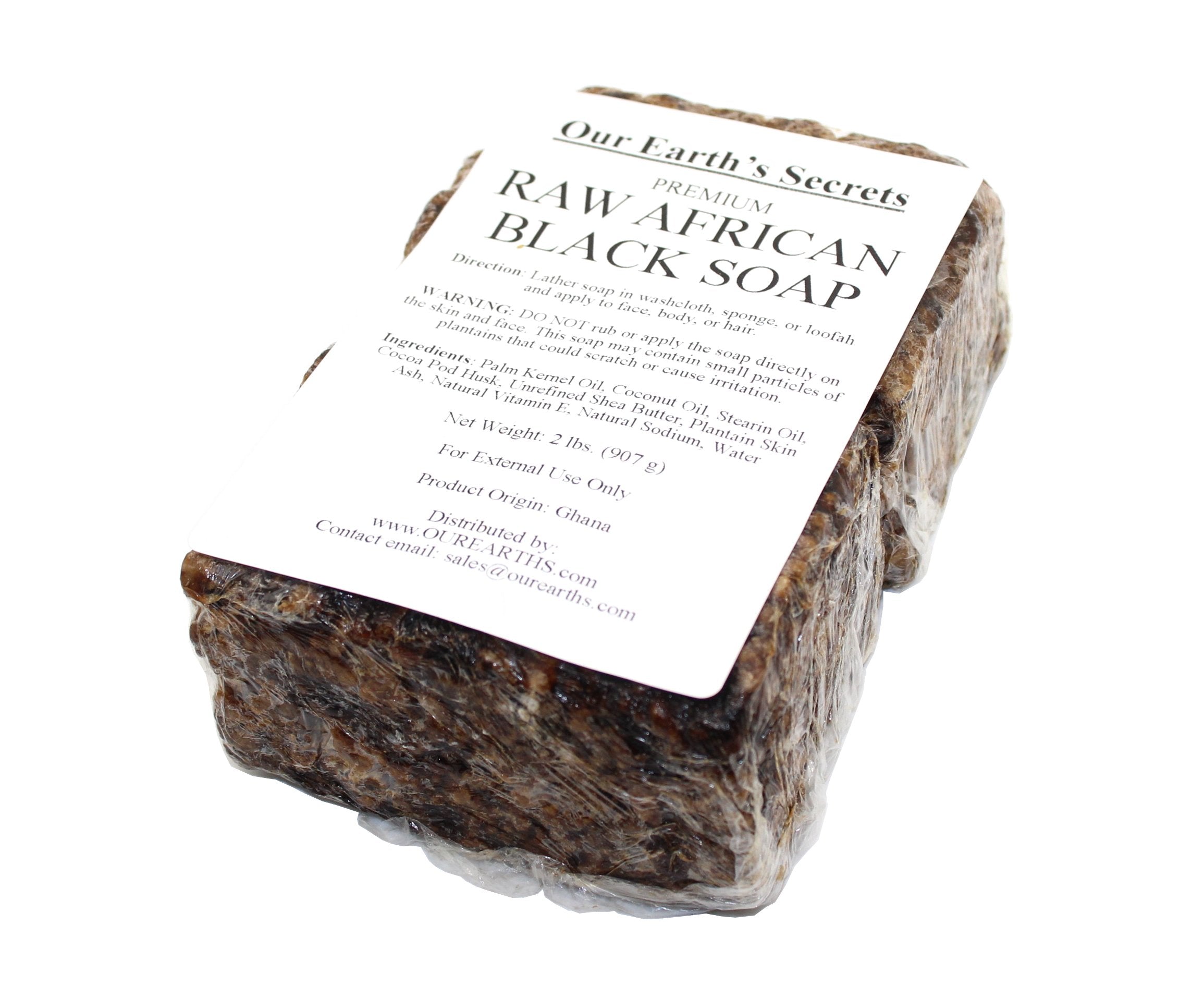 Our Earth's Secrets close-up of raw soap texture highlighting natural plant particles and gentle exfoliation