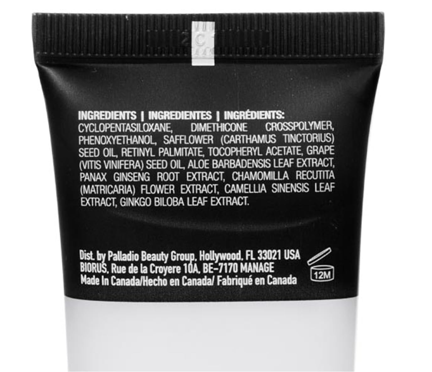 Palladio primer beside a coin for size comparison illustrating compact 0.674 oz benefit