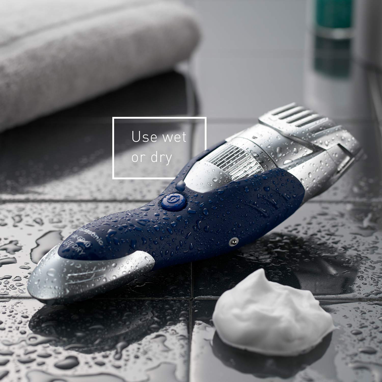 Panasonic ER-GB40-S rinsed under running water demonstrating easy waterproof cleaning