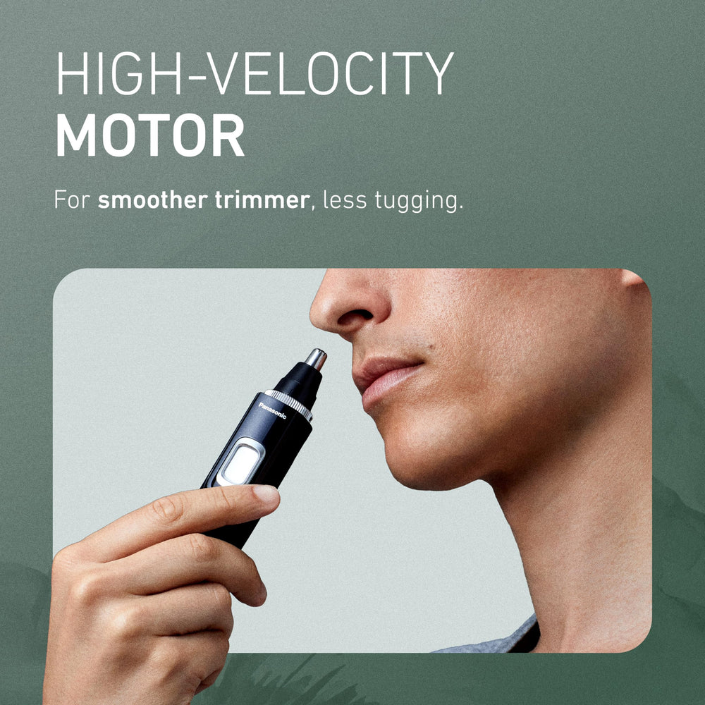 Panasonic ER-GN70-K held in hand at angle for reach and ergonomic control while grooming