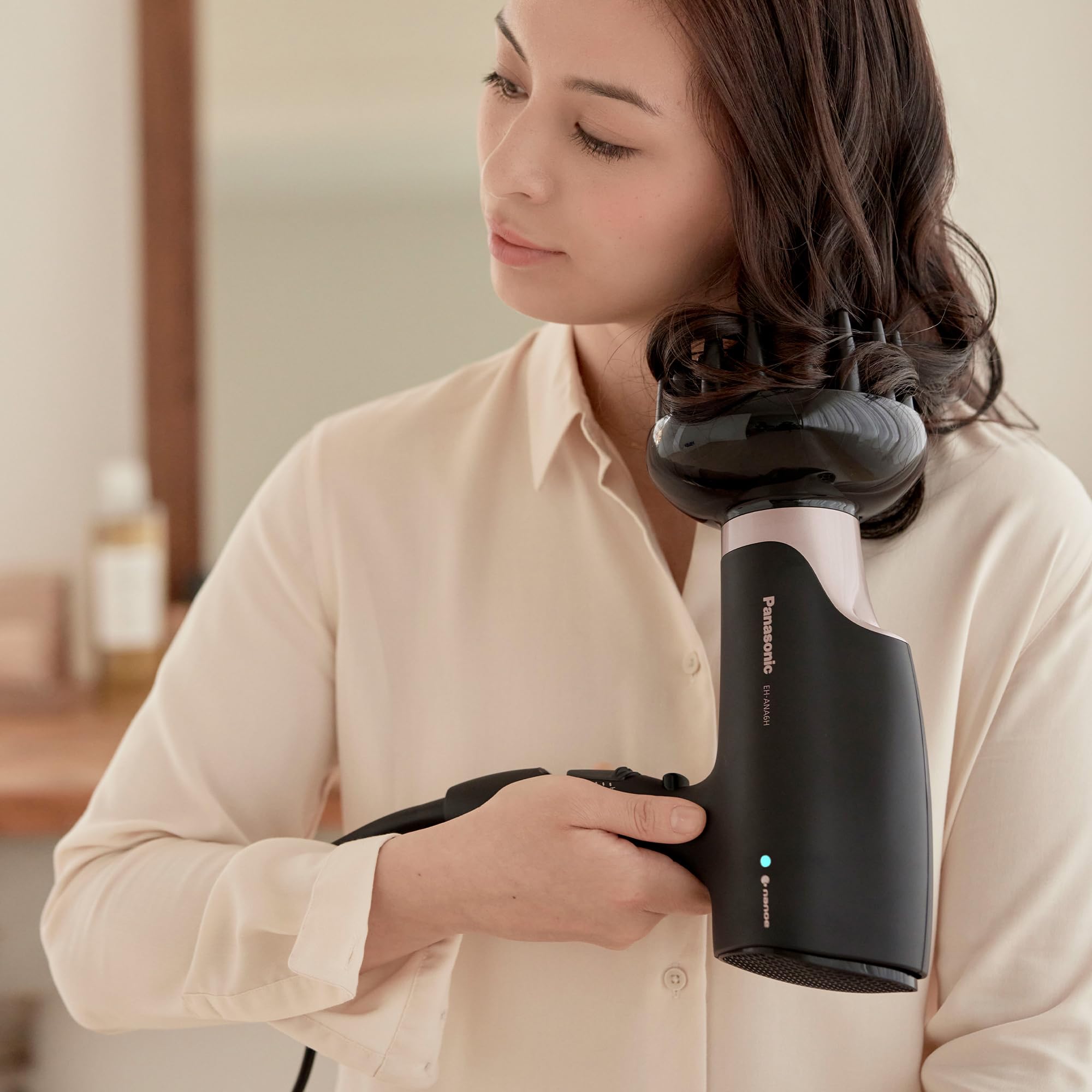 Panasonic dryer in use during salon-style blowout for professional results