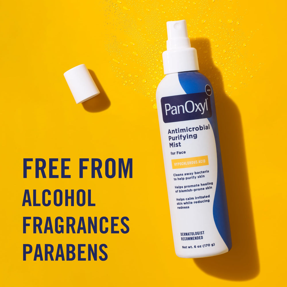 PanOxyl bottle held in hand for size comparison showing travel-friendly convenience benefit