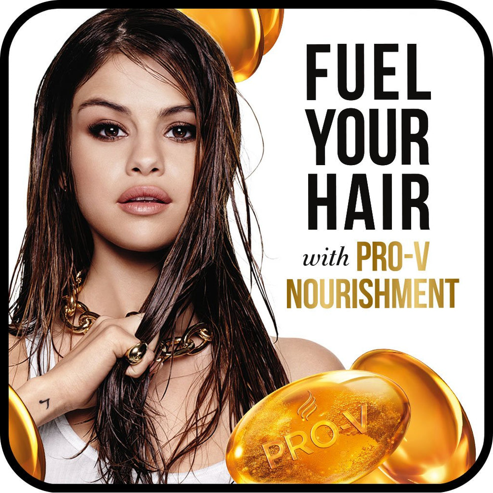 Applying Pantene Curl Perfection conditioner to wet curly hair for smoother, defined curls