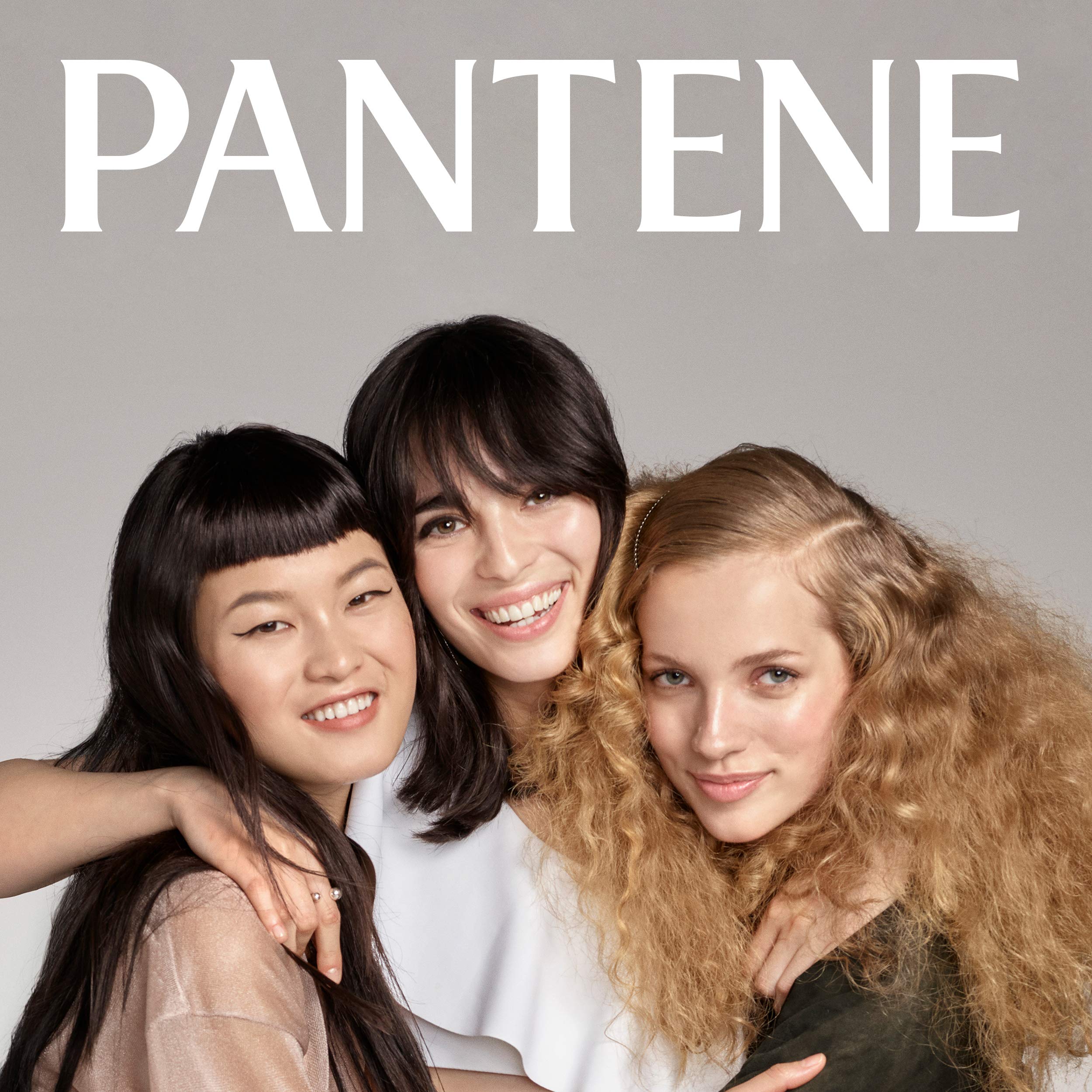 Curly hair after Pantene use showing defined, shiny curls