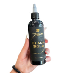 Panthera bottle next to ruler showing 150ml scale for studio supply clarity