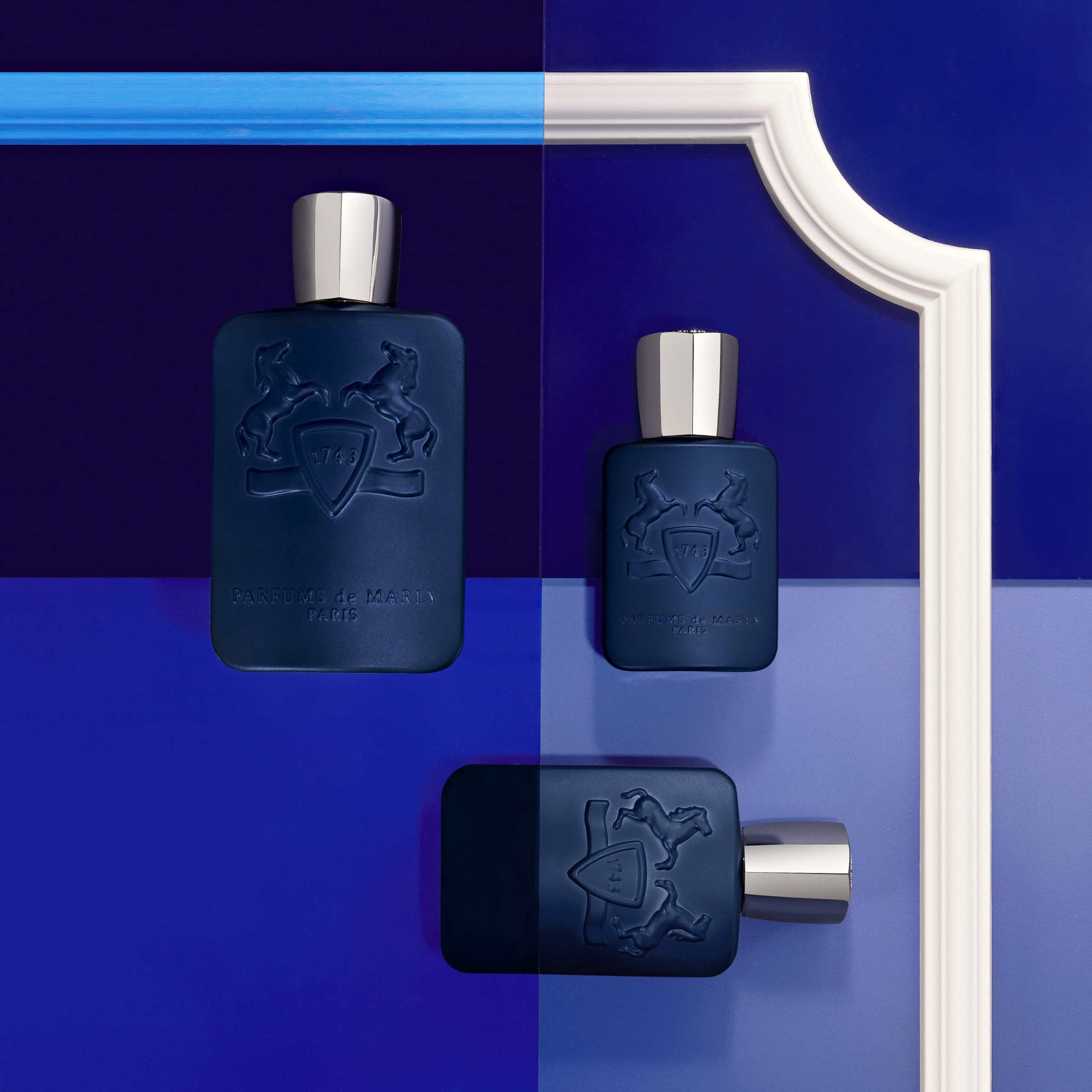 Parfums de Marly Layton 2.5 fl oz bottle next to everyday items for scale