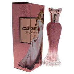 Paris Hilton Rose Rush next to a ruler showing 3.4 oz scale and travel suitability