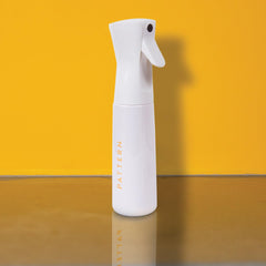 PATTERN continuous mist bottle front view showing refillable design and fine spray benefit