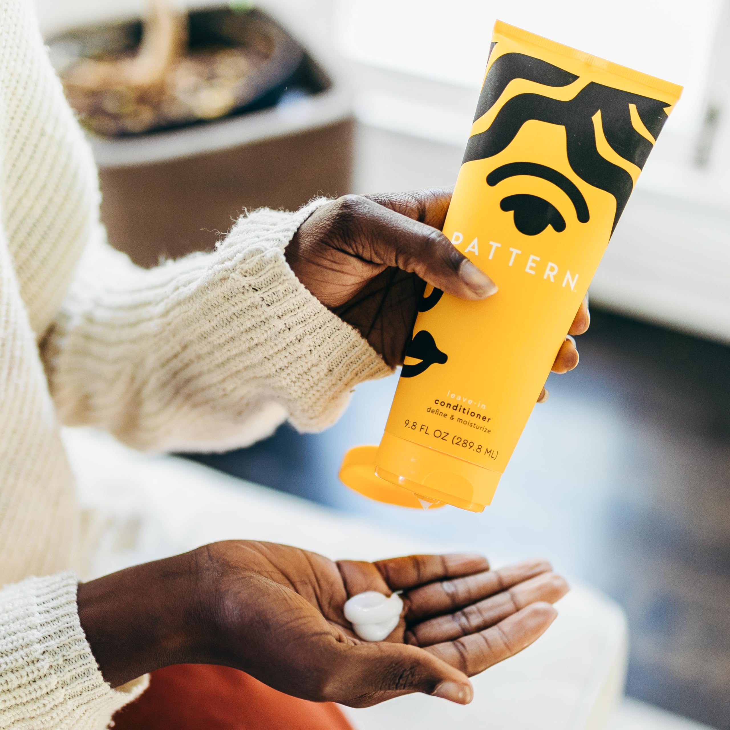 PATTERN products in hand for scale to show travel-friendly sizing benefit