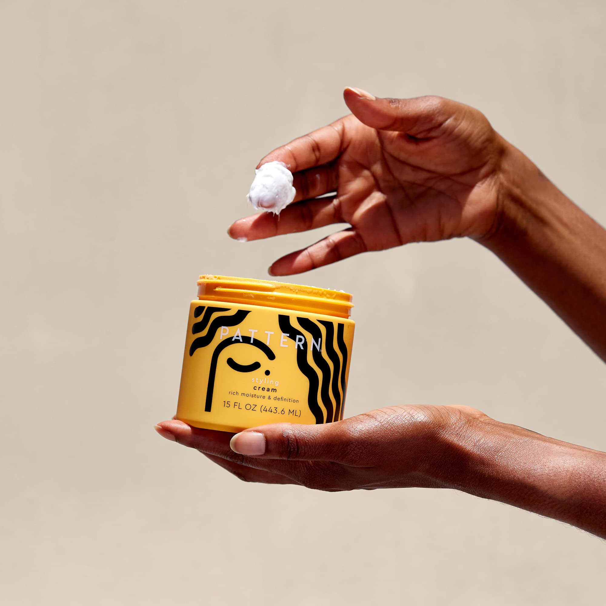PATTERN styling cream being applied to wet curly hair for frizz control