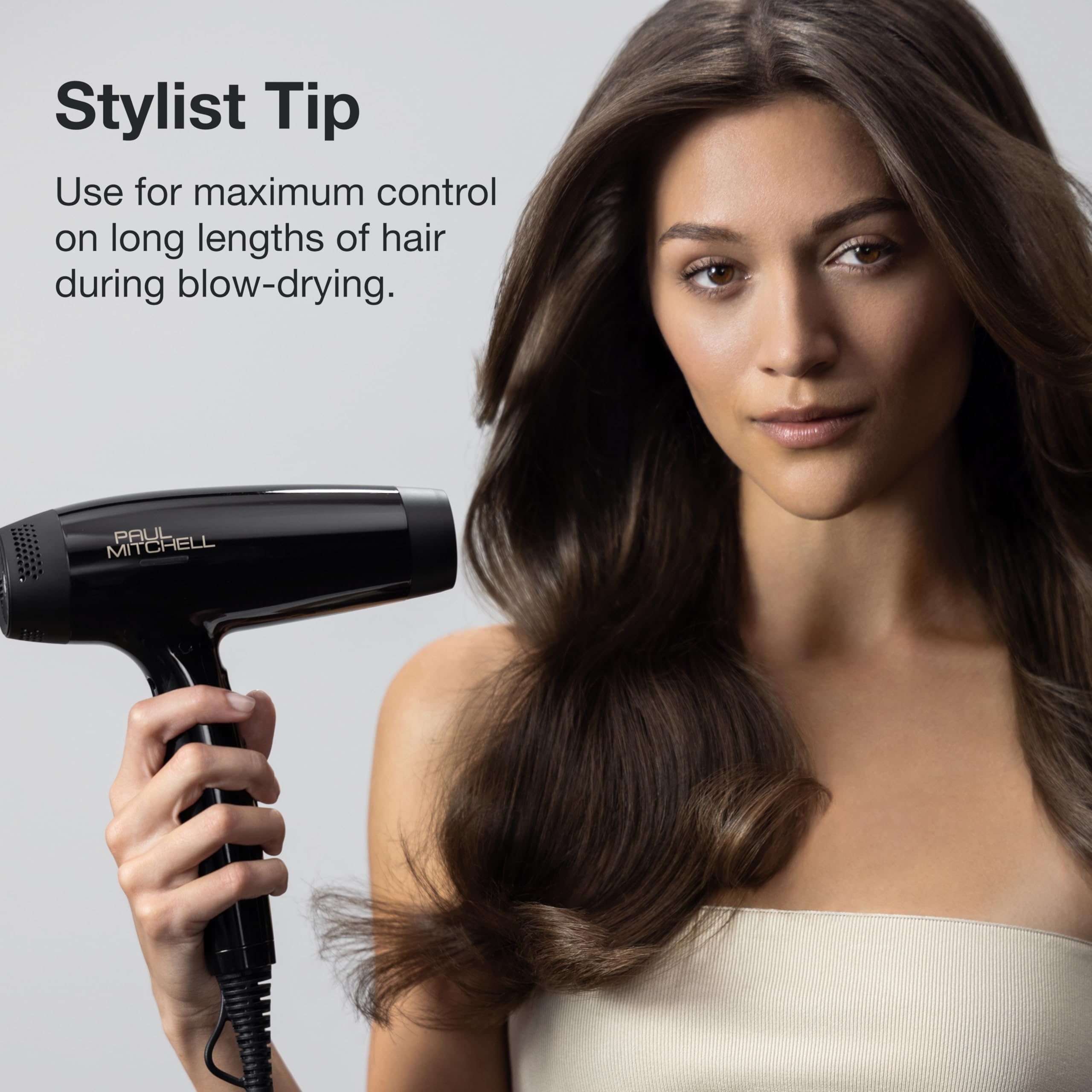 Paul Mitchell 427 brush in use while blow-drying demonstrating faster styling