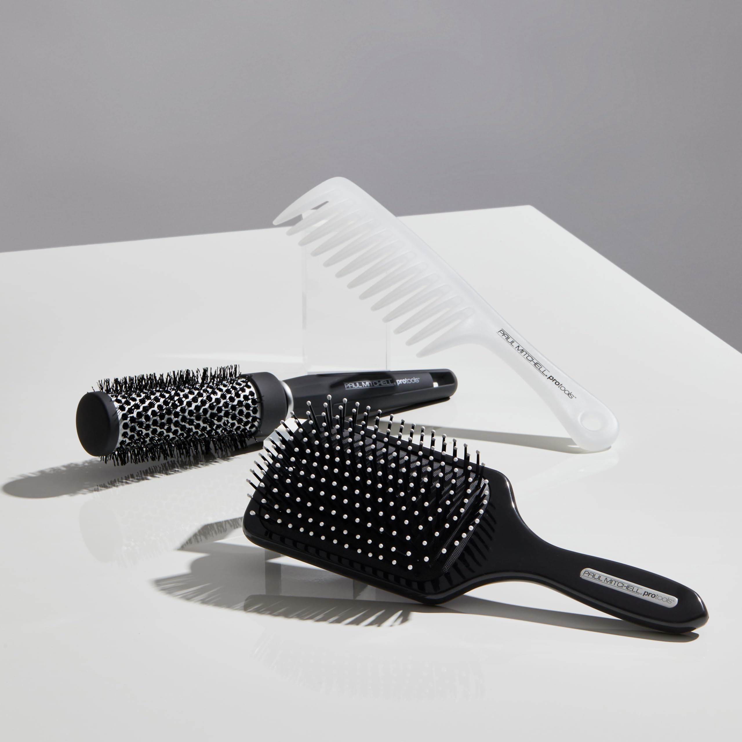 Paul Mitchell brush in use during blow-dry creating volume and faster results