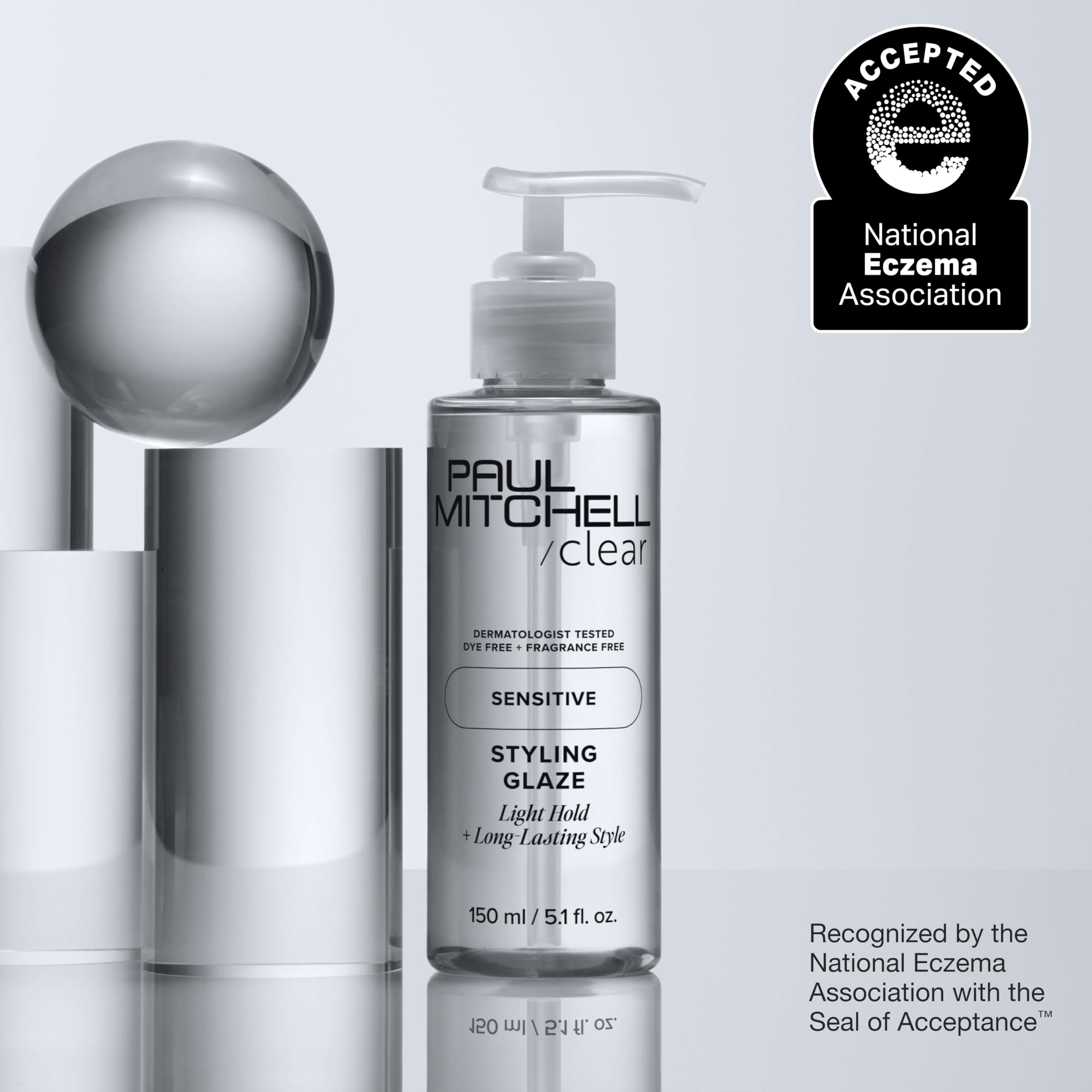 Finger applying Paul Mitchell glaze to hair for definition and reworkable styling benefit