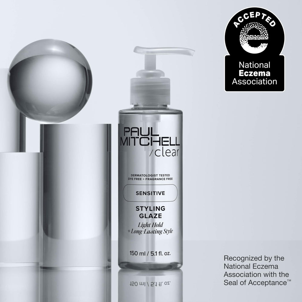 Finger applying Paul Mitchell glaze to hair for definition and reworkable styling benefit