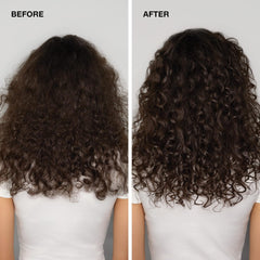 Hand holding Paul Mitchell glaze to show size and easy dispensing benefit