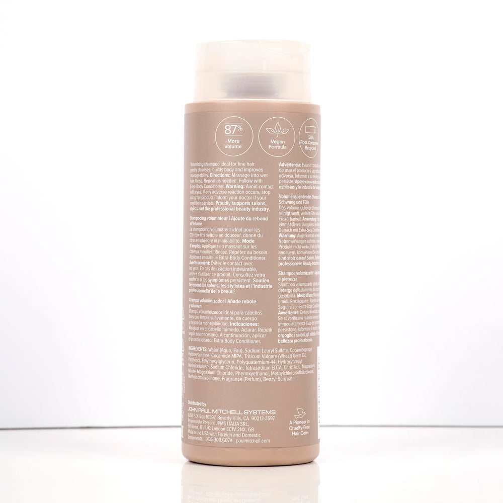 Paul Mitchell Extra-Body on bathroom shelf conveying salon-quality routine benefit