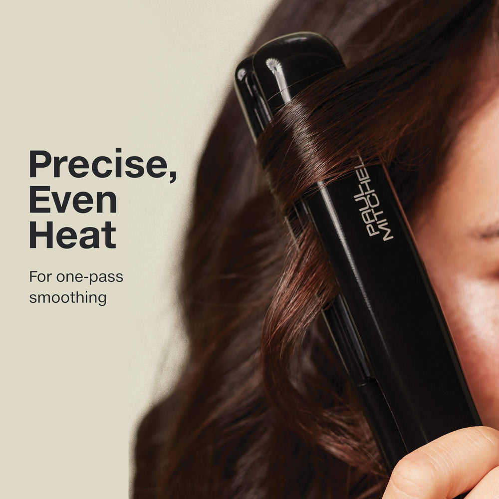 Paul Mitchell flat iron in use styling hair to show smooth straightening benefit