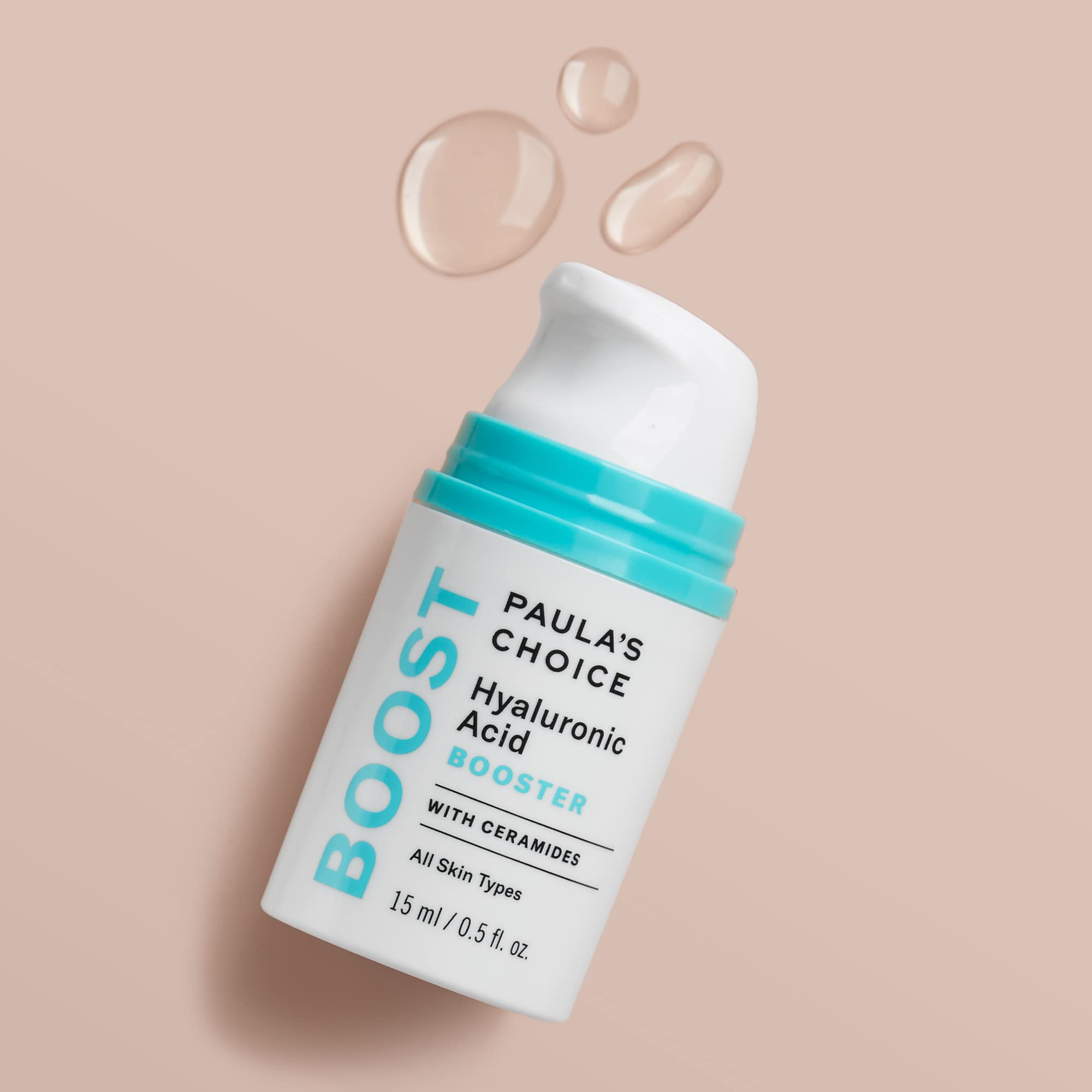 Paula's Choice booster on hand for size and consistency, showing quick absorption benefit