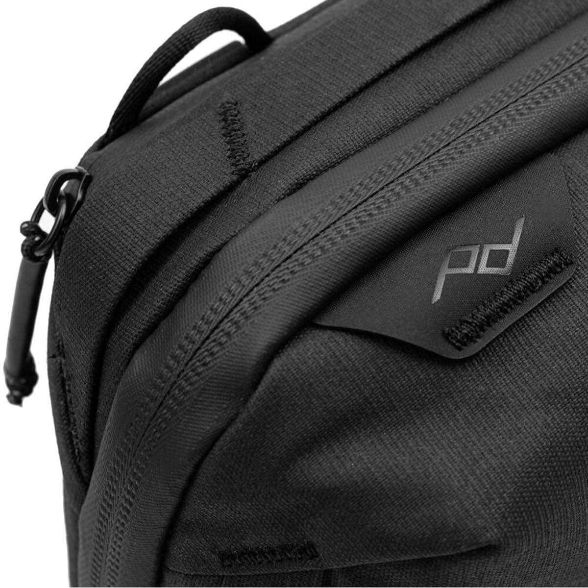 Peak Design tech pouch on a travel table illustrating easy access and everyday carry convenience