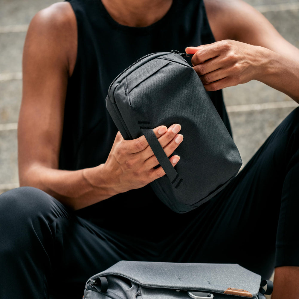Peak Design tech pouch open clamshell revealing organized origami-style storage and items