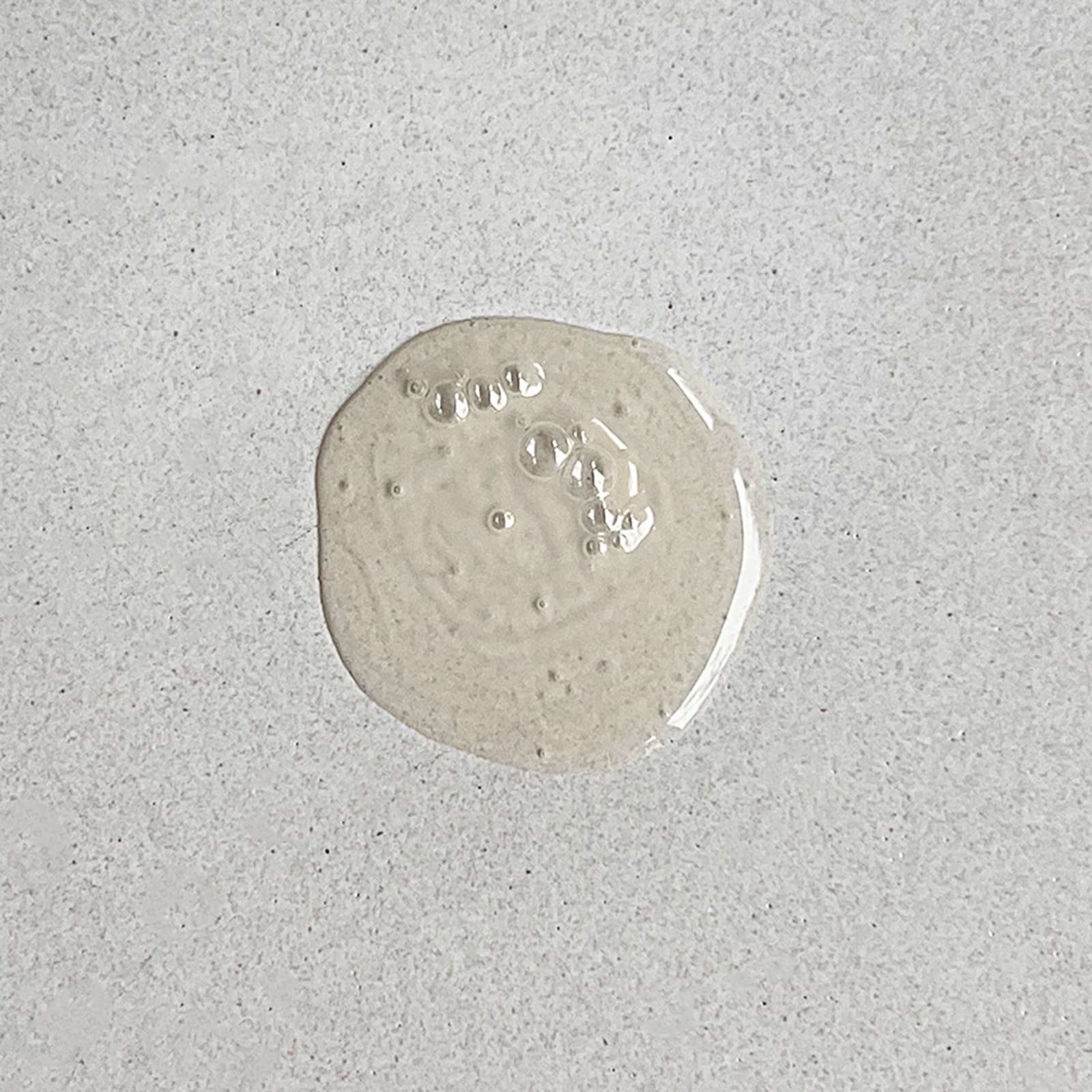 Pharmacopia bottle beside a hand for scale showing convenient 16.2 oz benefit