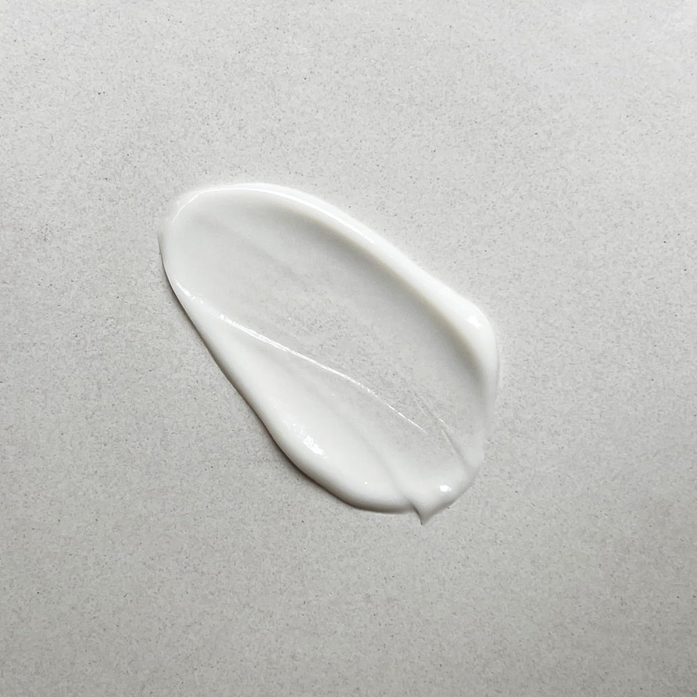 Pharmacopia close-up pump dispensing lotion revealing silky, fast-absorbing texture