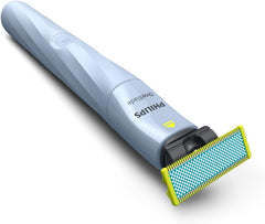 PHILIPS OneBlade held in hand showing size and travel-ready convenience for teens