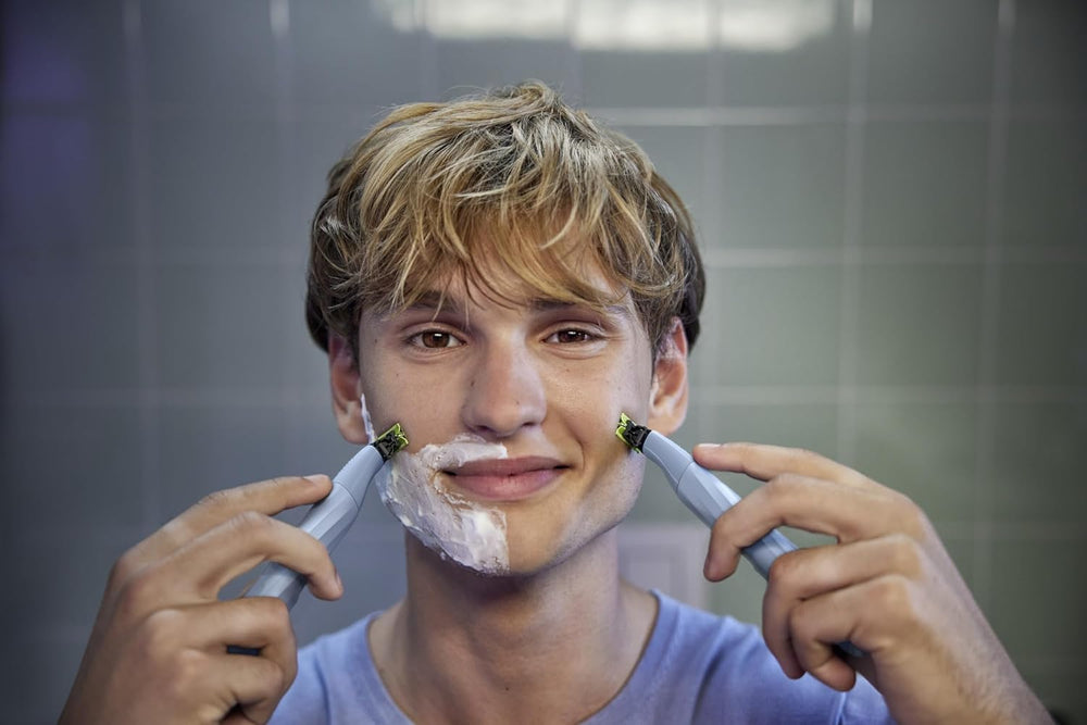 PHILIPS OneBlade being used in shower illustrating waterproof design and quick rinseability