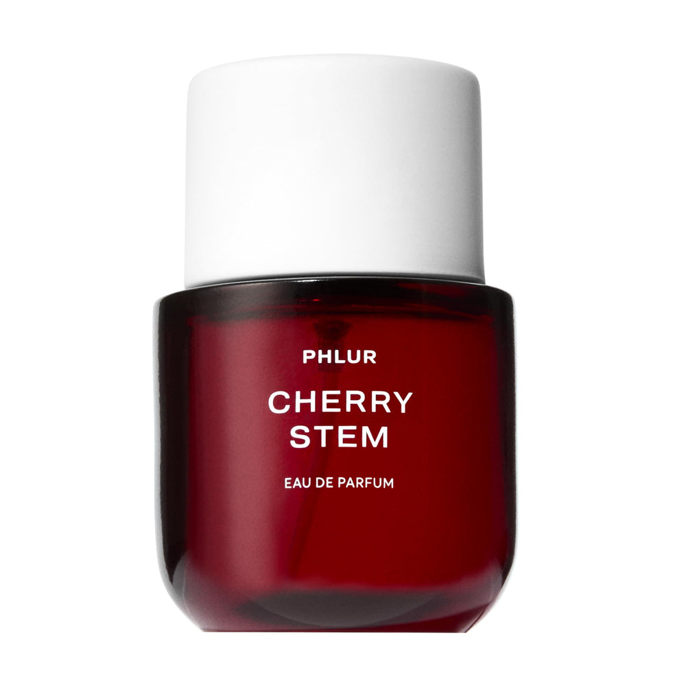 PHLUR front bottle view showing sleek glass and label, highlights premium design