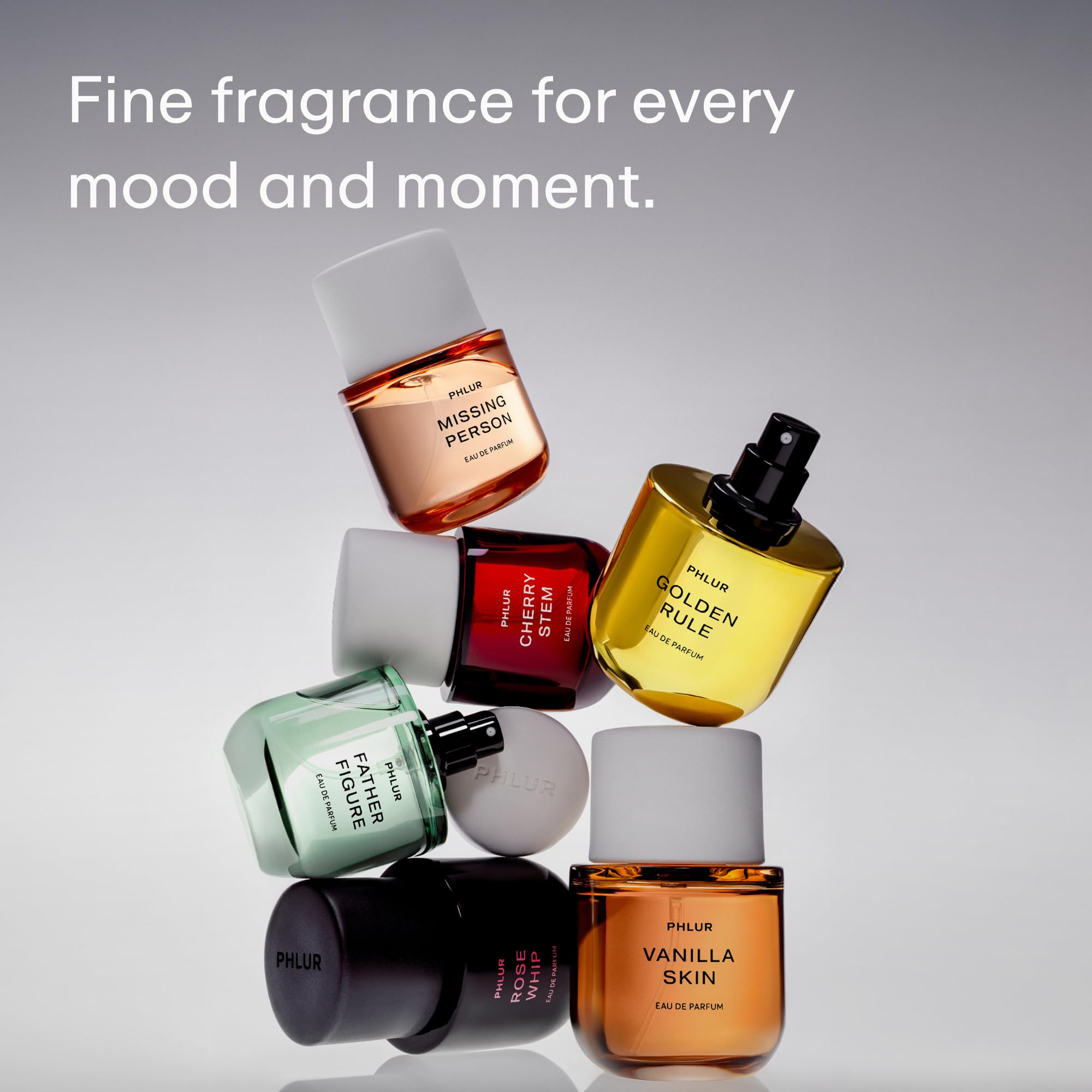 PHLUR 50 mL bottle beside common objects showing compact travel-friendly size