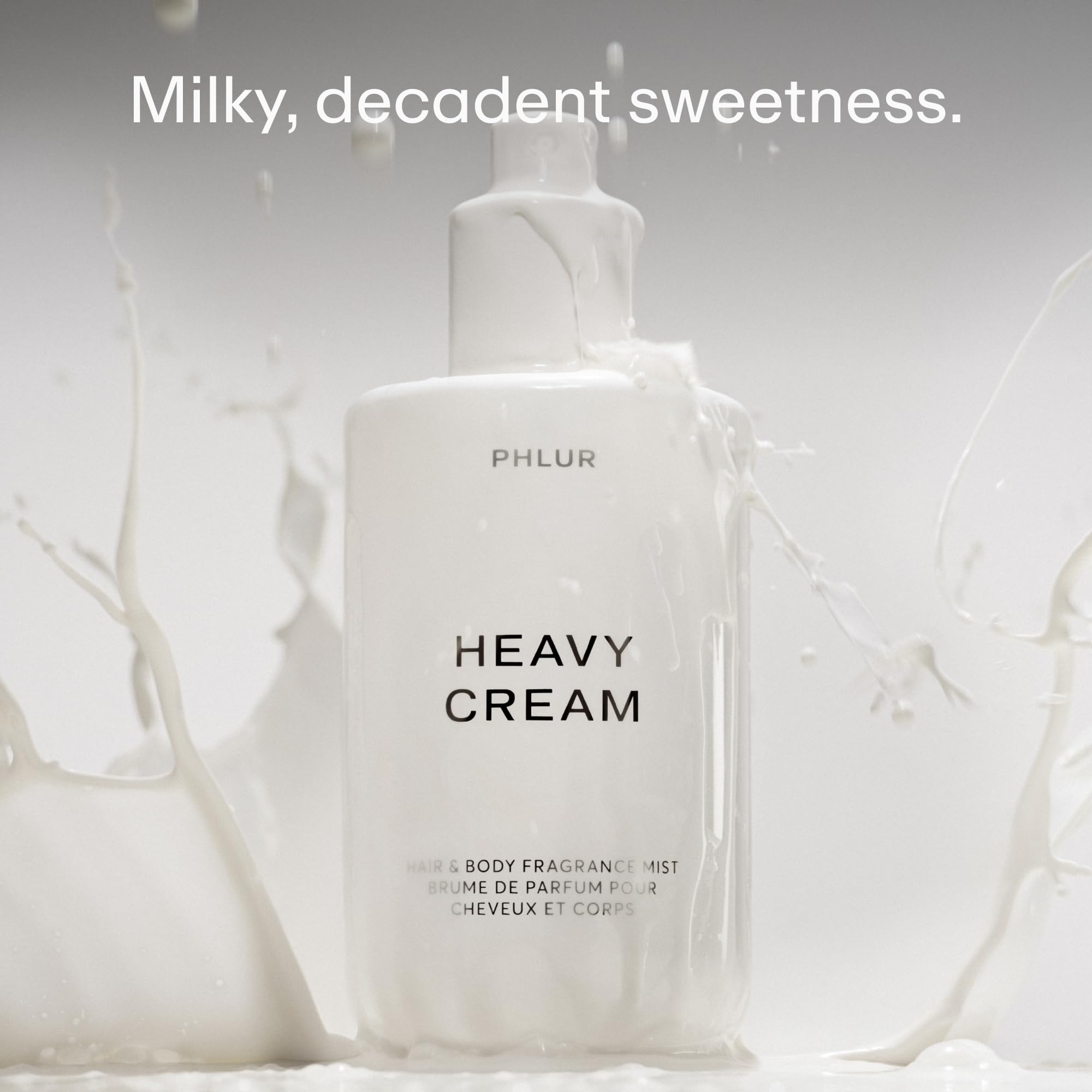 PHLUR mist spraying from bottle demonstrating fine, even application