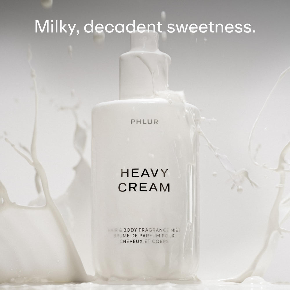 PHLUR mist spraying from bottle demonstrating fine, even application