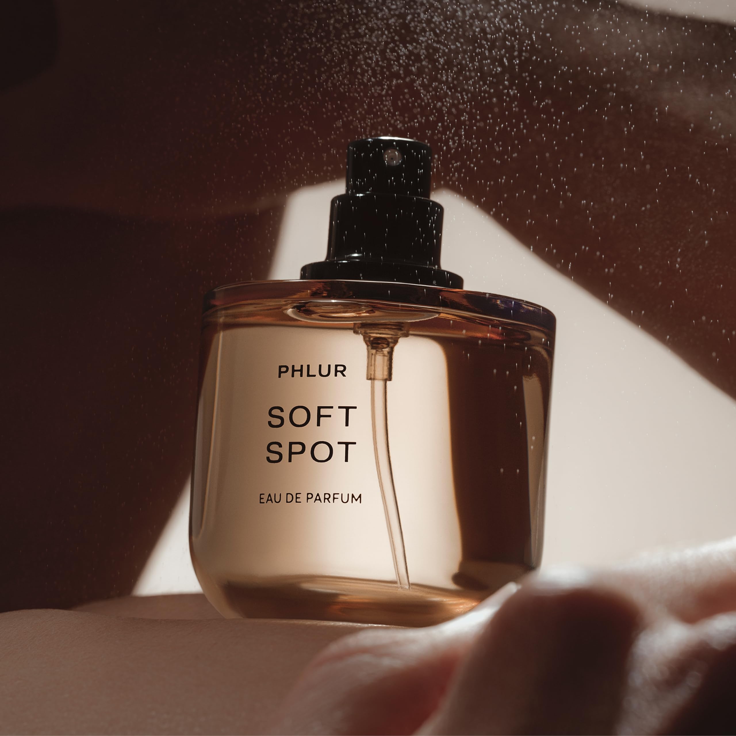 PHLUR fine mist spray in motion demonstrating controlled application