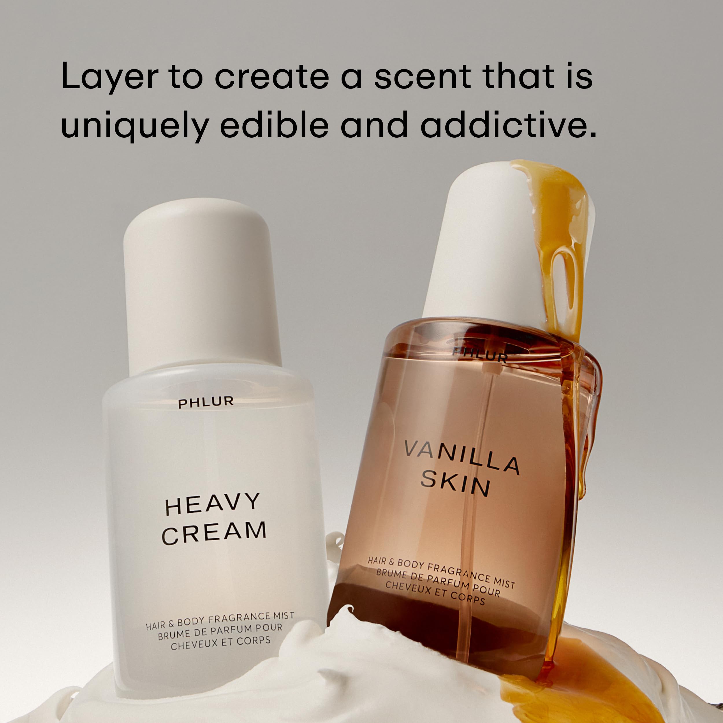 PHLUR mist spraying onto skin demonstrating lightweight application and freshness