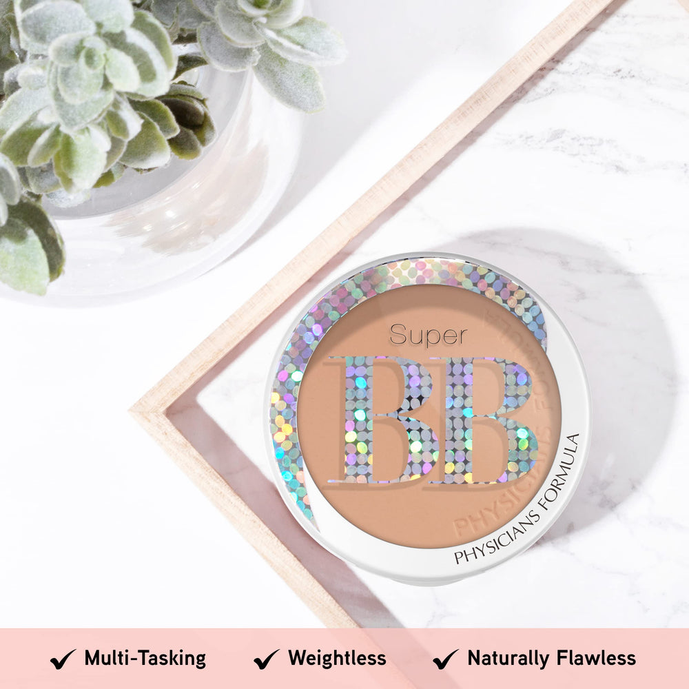 Physicians Formula compact held in hand to show scale and easy portability