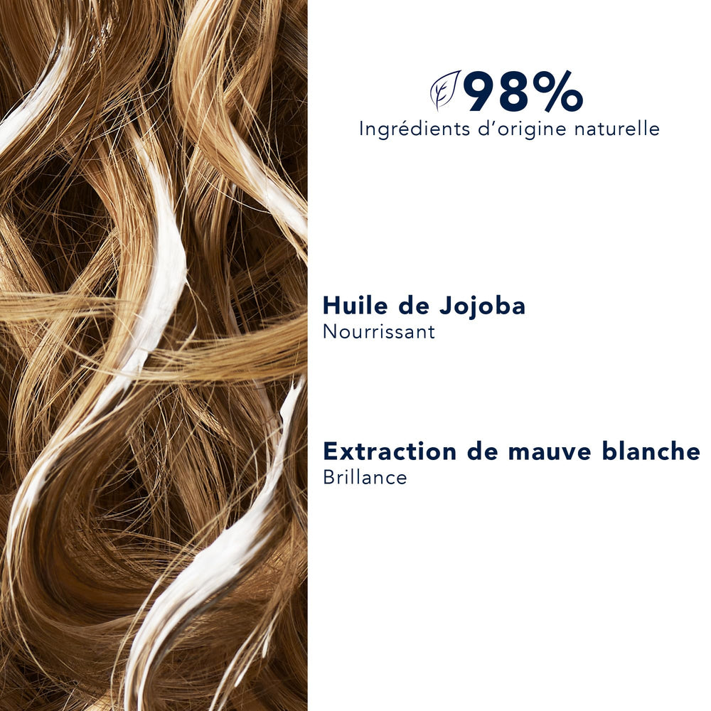 PHYTO conditioner being applied to wet hair for easier detangling and smoother strands