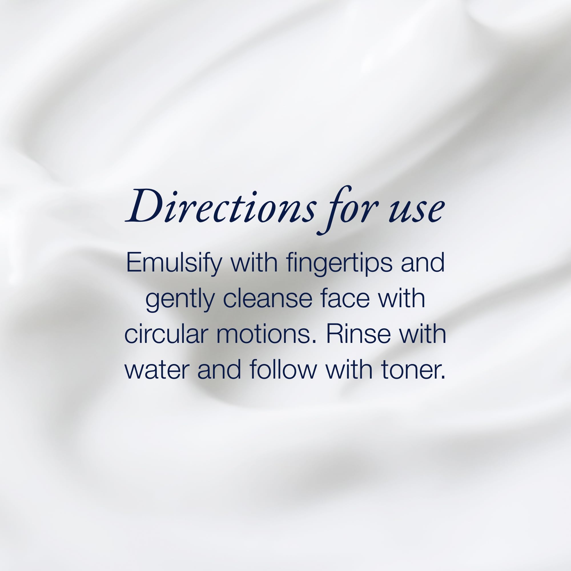Phytomer cleansing milk beside hand for size comparison and portion guidance
